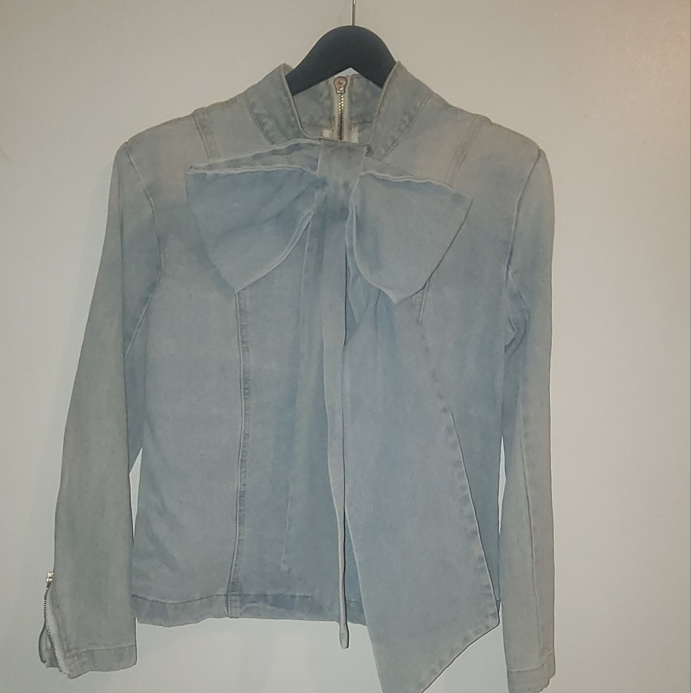 Light Blue Denim Top with an exposed zipper In the back.